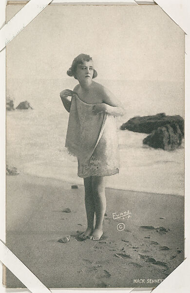 Bathing beauty on sand holding up towel from Mack Sennett Comedies ...