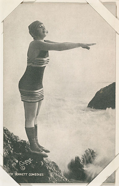 Bathing beauty poised to dive off rock from Mack Sennett Comedies ...