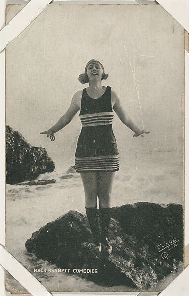 Bathing beauty on rocks with arms outstretched from Mack Sennett Comedies Arcade series (W423), Commercial photolithograph 
