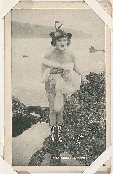 Bathing beauty in costume with white fur from Mack Sennett Comedies Arcade series (W423), Commercial photolithograph 
