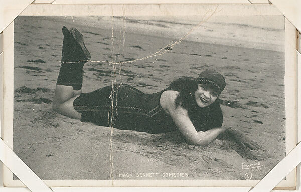 Bathing beauty in costume laying on beach from Mack Sennett Comedies Arcade series (W423), Commercial photolithograph 