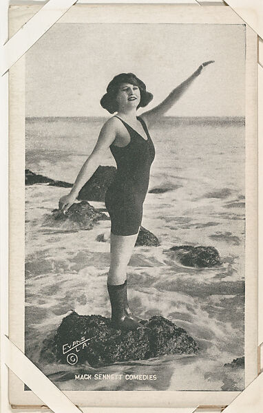 Bathing beauty standing on rock with arm lifted from Mack Sennett Comedies Arcade series (W423), Commercial photolithograph 