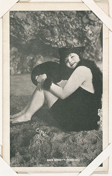 Bathing beauty seated in costume with fur from Mack Sennett Comedies Arcade series (W423), Commercial photolithograph 