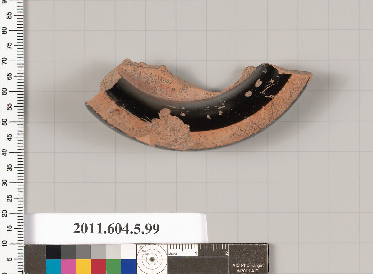 Terracotta fragment of a stemless kylix (drinking cup), Terracotta, Greek, Attic