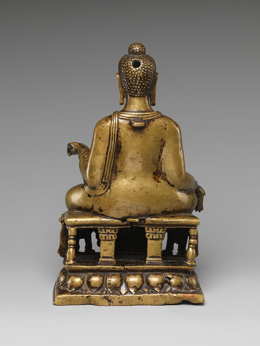 Enthroned Buddha Granting Boons, Gilt brass with silver and copper inlay, Pakistan (Gilgit Kingdom)