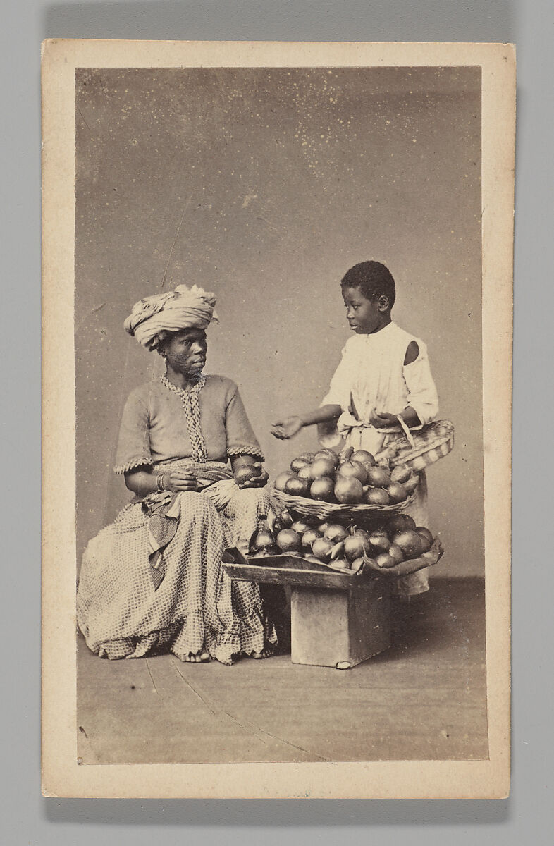 [Studio Portrait: Seated Woman and Standing Boy Street Vendors with Vegetable Baskets, Brazil], Christiano Junior (Portuguese, active Argentina, 1832–1902), Albumen silver print 