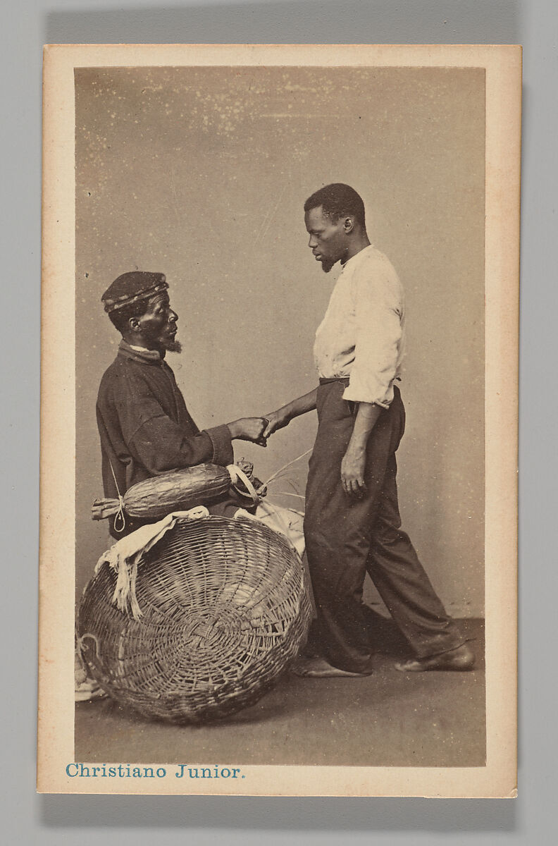 [Studio Portrait: Two Male Street Vendors in Profile, one Seated one Standing, Shaking Hands, Brazil], Christiano Junior (Portuguese, active Argentina, 1832–1902), Albumen silver print 