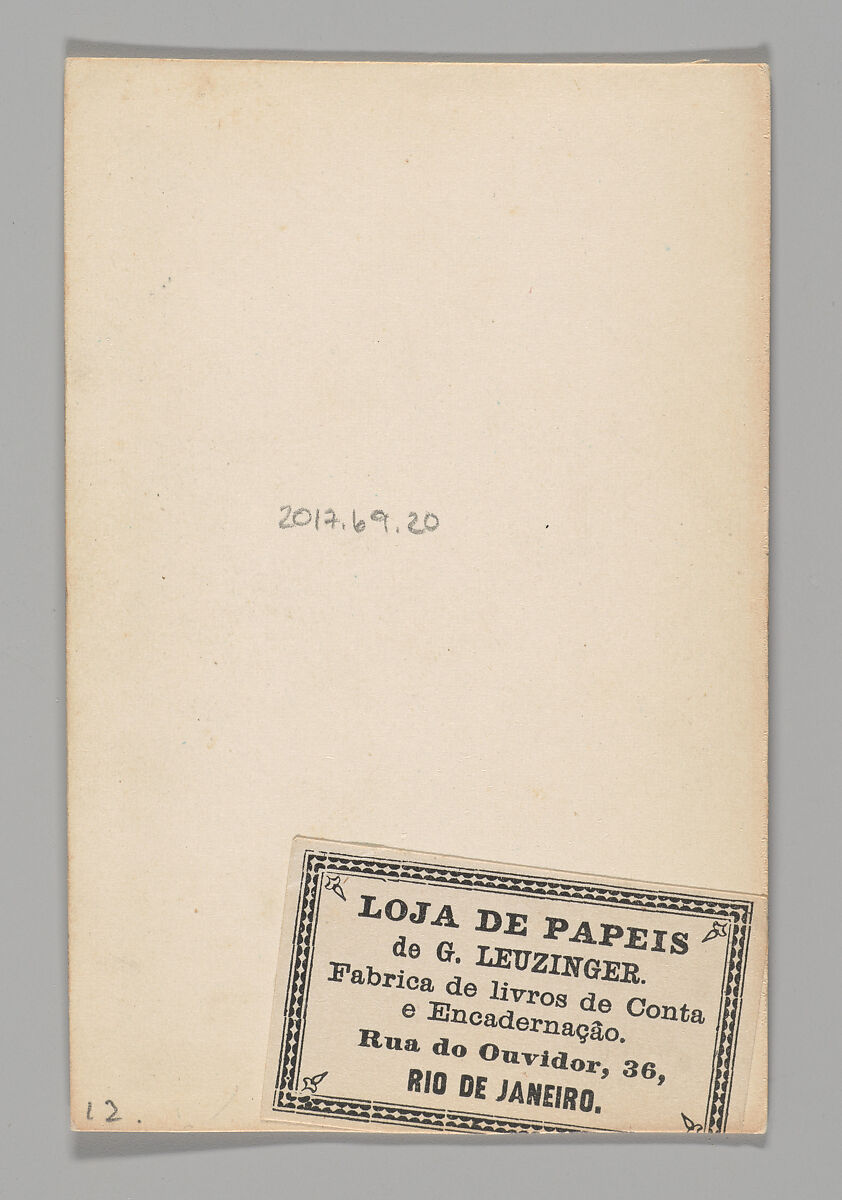 [Studio Portrait: Male Street Vendor Holding Box of Flowers, Brazil], Unknown, Albumen silver print