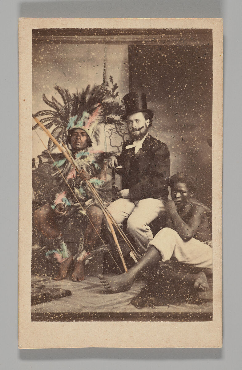 [Studio Portrait: Man Wearing Top Hat Seated with 2 Indigenous People], Unknown, Albumen silver print with applied color 