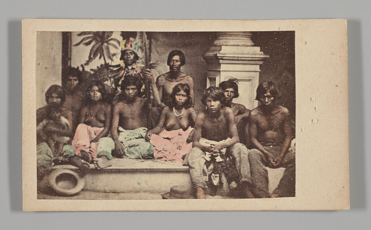 [Studio Portrait: Seated Group portrait of Ten Indigenous people], Unknown, Albumen silver print with applied color 