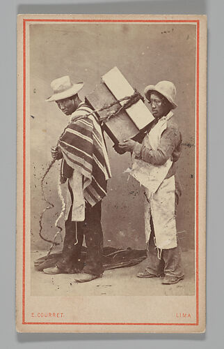 [Studio Portrait: Two Men, one with Box Tied to his Back, Lima]