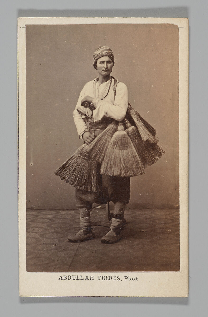 [Studio Portrait: Person with Brooms, Syria], Abdullah Frères (Ottoman, 1858–1899), Albumen silver print 