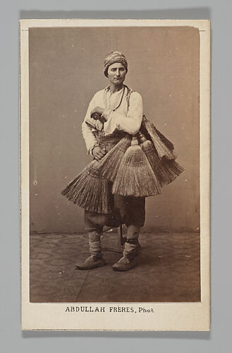 [Studio Portrait: Person with Brooms, Syria]