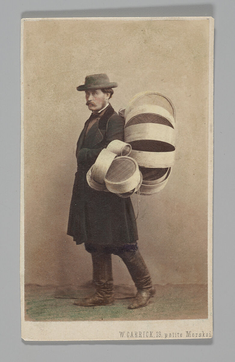[Studio Portrait: Man in Coat Carrying Baskets, St. Petersburg], William Carrick (British, Edinburgh, Scotland 1827–1878 St. Petersburg, Russia), Albumen silver print 