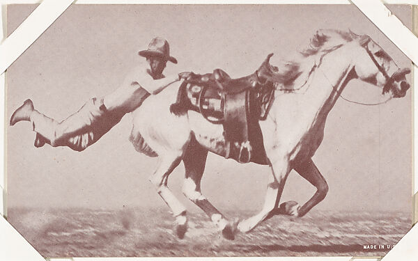 Cowboy hanging on back of saddle of white horse from Indians and Western Historical Scenes series (W417), Commercial color photolithograph 