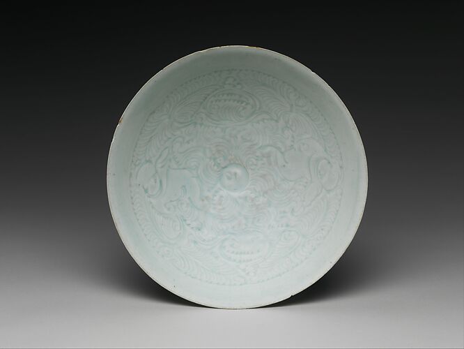 Bowl with two boys and foliage