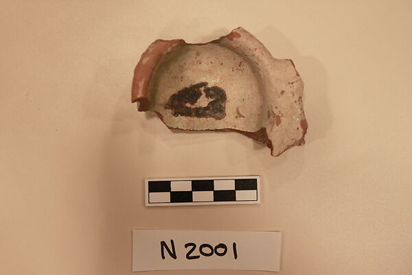 Ceramic Fragment, Earthenware; white slipped, slip-painted under a colorless glaze with green stains 