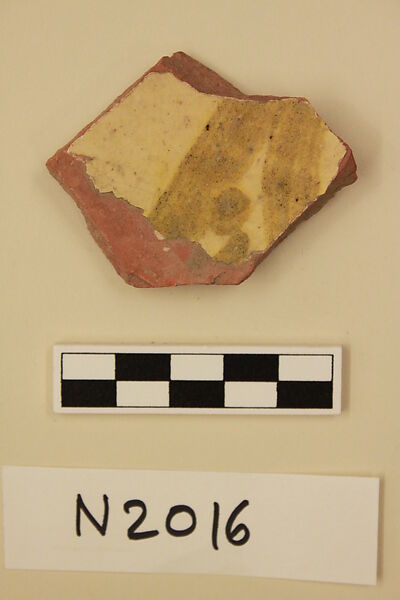 Ceramic Fragment, Earthenware; slipped, slip-painted in green under a yellow glaze 