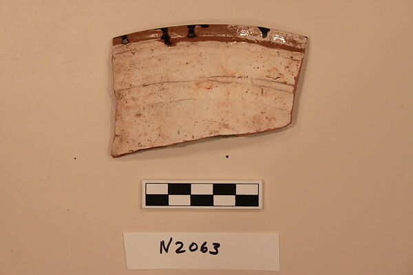 Ceramic Fragment, Earthenware; white slipped, slip-painted under a yellow glaze