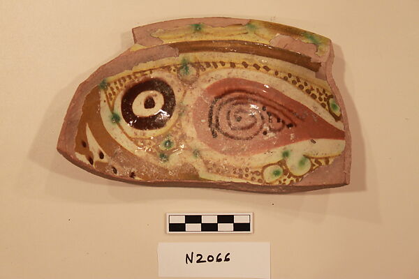 Ceramic Fragment, Earthenware; white slipped, slip-painted under a colorless glaze with green stains 