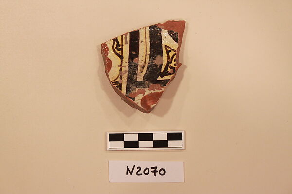 Ceramic Fragment, Earthenware; white slipped, slip-painted under a yellow glaze 