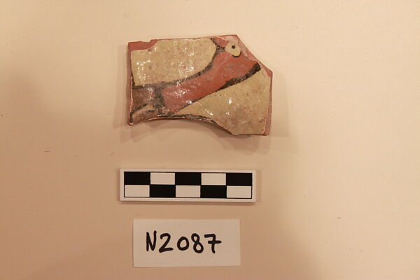 Ceramic Fragment, Earthenware; white slipped, slip-painted under a colorless glaze with a  light yellowish tintage 