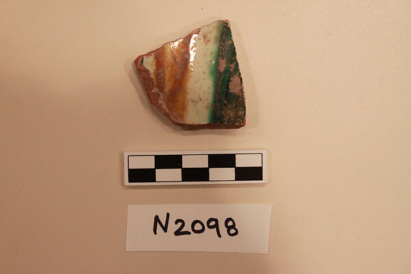 Ceramic Fragment, Earthenware; white slipped,incised and splashed under a colorless glaze 