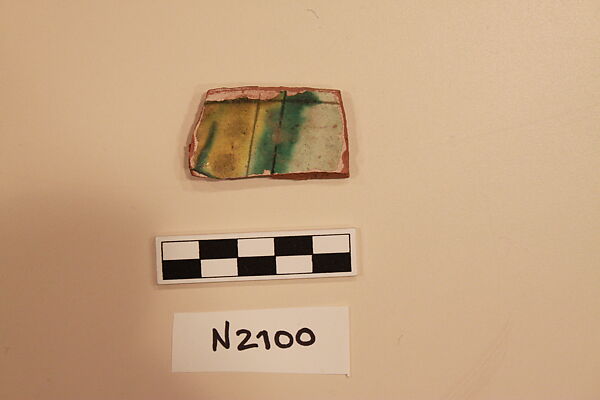 Ceramic Fragment, Earthenware; white slipped,  incised and splashed with polychrome glazes under a transparent green glaze 