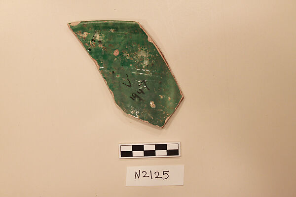 Ceramic Fragment, Earthenware; white slipped, with a green glaze 