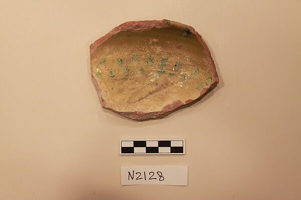Ceramic Fragment, Earthenware; white slipped, with a green glaze.