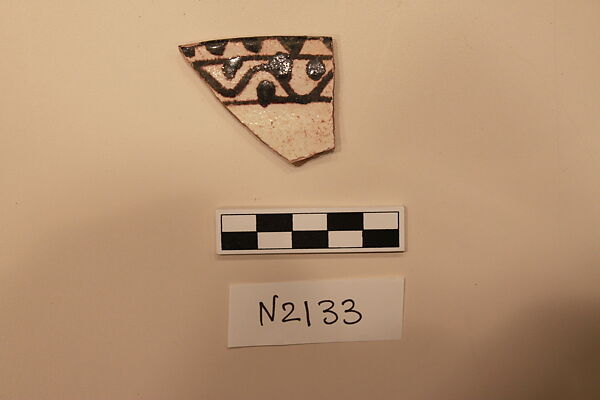 Ceramic Fragment, Earthenware;  white slip, slip painted under a colorless glaze. 