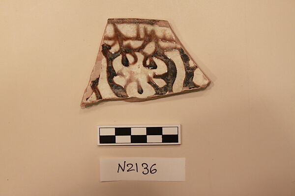 Ceramic Fragment, Earthenware; white slipped, slip painted, under a colorless glaze 