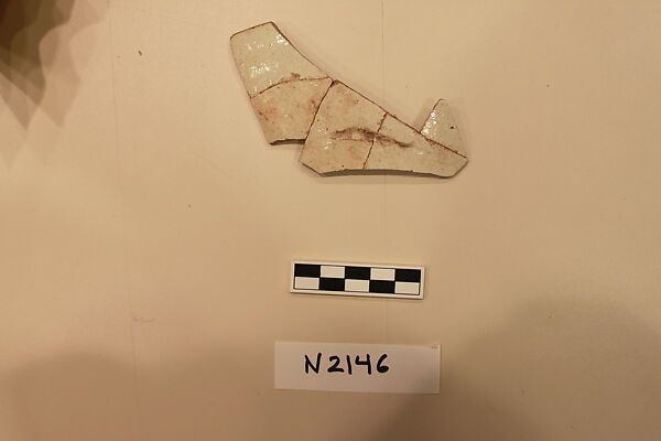 Ceramic Fragment, Earthenware; white slipped, slip-painted with a colorless glaze