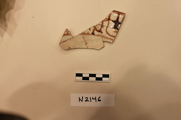 Ceramic Fragment, Earthenware; white slipped, slip-painted with a colorless glaze 