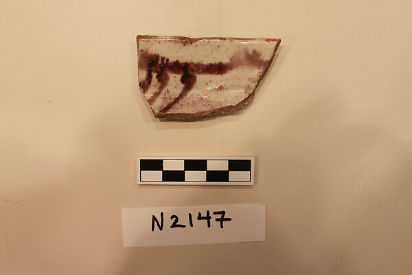 Ceramic Fragment, Earthenware; white slipped, painted with dark brown glaze. 