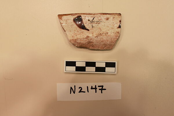 Ceramic Fragment, Earthenware; white slipped, painted with dark brown glaze.