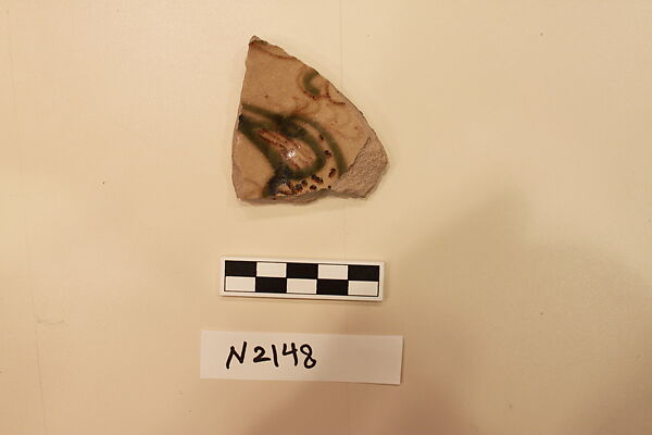 Ceramic Fragment, Stoneware?; painted with slip and glaze, covered in a light green glaze 
