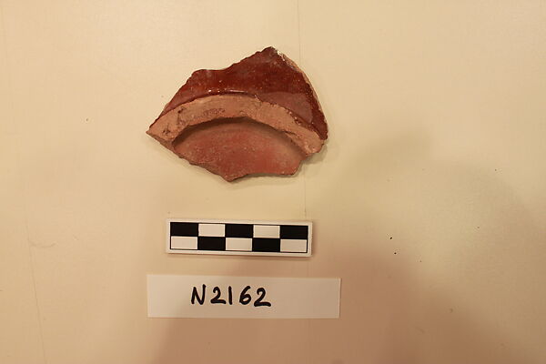 Ceramic Fragment, Earthenware; red slipped under a colorless glaze