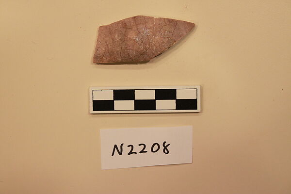 Ceramic Fragment, Stonepaste; molded decoration under a purple glaze