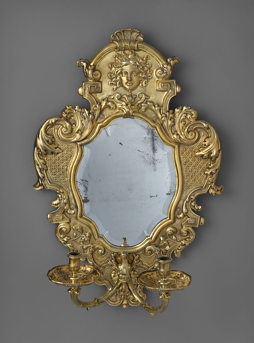 Monumental mirror sconce (one of a pair), Peter Rahm (German, 1661–1737), Silver, embossed, chiseled, engraved and gilded; mirror glass (19th century replacement); wood frame, German, Augsburg 