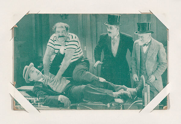 Jimmy Adams and Jack Duffy in "Gimmie Strength" from Scenes from Movies Exhibit Cards series (W404), Exhibit Supply Company, Commercial color photolithograph 