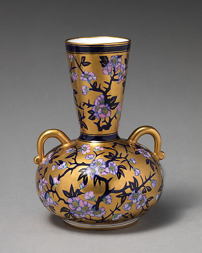 Vase with branch of white blossom (one of a pair)