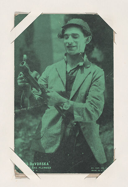 Jesse DeVorska in "Jake the Plumber" from Scenes from Movies Exhibit Cards series (W404), Exhibit Supply Company, Commercial color photolithograph 