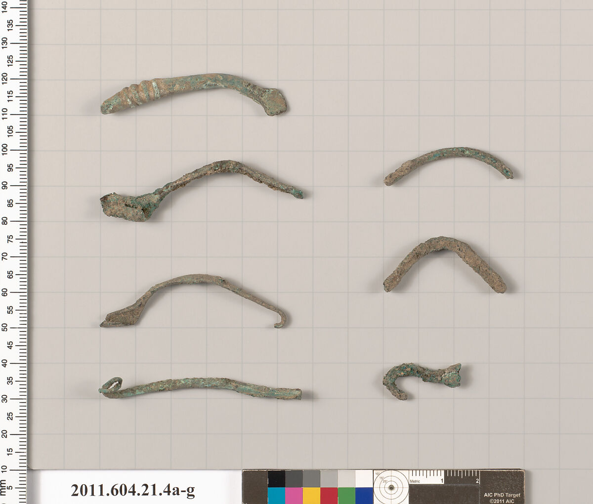 Fragments of fibulae (safety pins), Bronze 