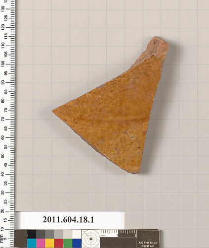 Fragment of a glazed ceramic plate or bowl