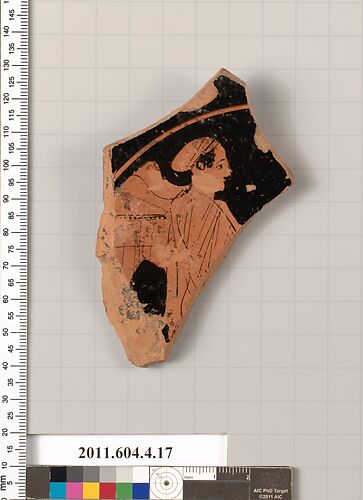 Terracotta fragment of a stemless kylix (drinking cup)