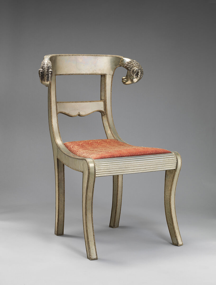 Side chair with rams' heads (one of a pair), White alloy metal sheets (silvered?) over wooden core, probably teak; silk and metallic woven textile, Anglo-Indian