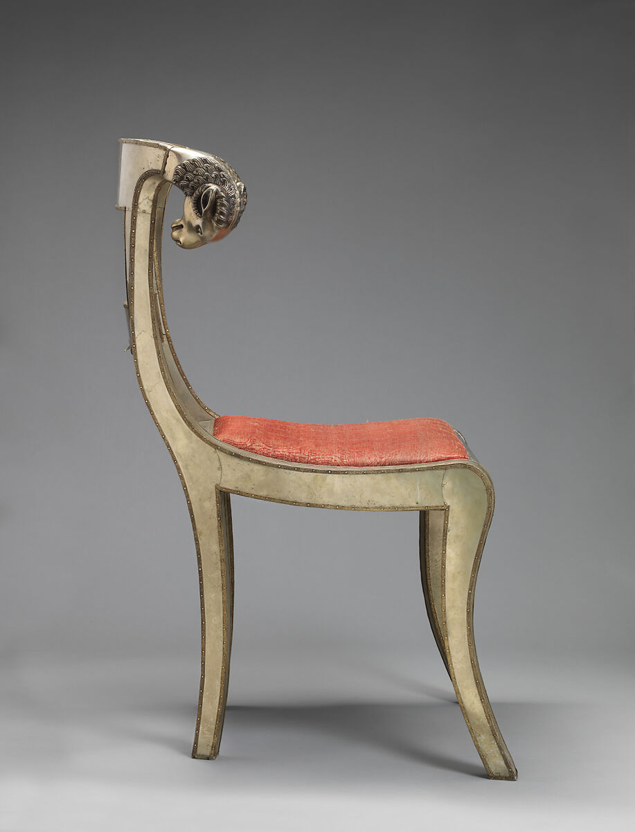 Side chair with rams' heads (one of a pair), White alloy metal sheets (silvered?) over wooden core, probably teak; silk and metallic woven textile, Anglo-Indian