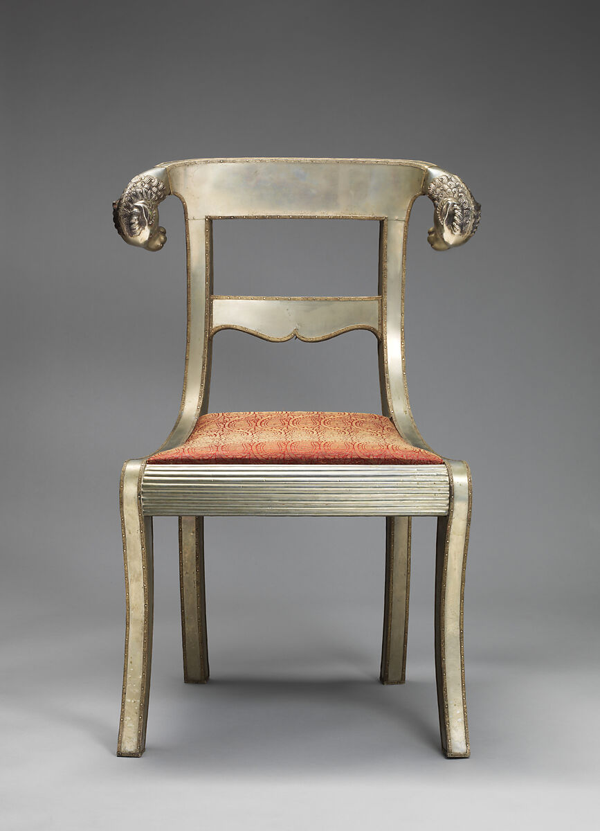 Side chair with rams' heads (one of a pair), White alloy metal sheets (silvered?) over wooden core, probably teak; silk and metallic woven textile, Anglo-Indian 