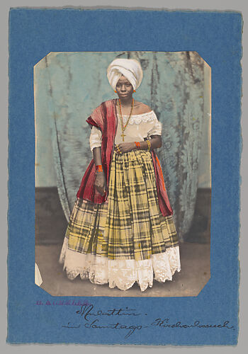 [Studio Portrait of Woman Wearing Head Scarf, Shawl, and Plaid Skirt, Brazil]